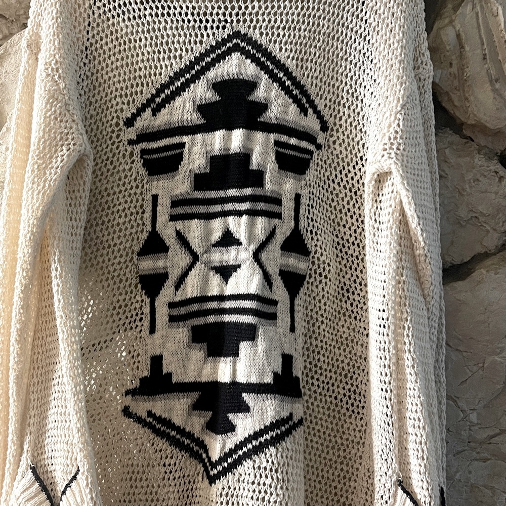 Maurice’s crocheted cardigan with Aztec print on back.